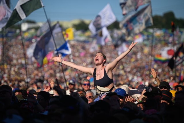 People sing along as Lewis Capaldi performs on the Pyramid Stage on Day 4 of Glastonbury Festival 2023 on June 24, 2023 in Glastonbury, England. The Glastonbury Festival of Performing Arts sees musicians, performers and artists come together for three days of live entertainment. (Photo by Leon Neal/Getty Images)