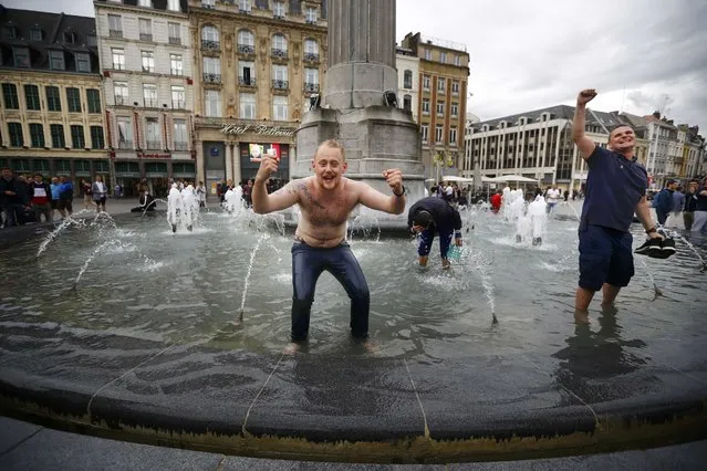 Football Soccer  EURO 2016  Lens, France on June 16, 2016. England fans celebrate their team's win in a fountain in Lille. (Photo by Pascal Rossignol/Reuters)
