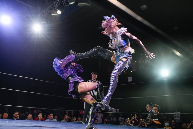 This picture taken on September 14, 2024 shows Japanese wrestler Yuki Kamifuku (R) fighting her opponent “Crystal” of the Philippines during a Middle Kingdom Wrestling (MKW) championship event in Shanghai. Despite a promising potential domestic market, the Chinese pro wrestling community has been battling for recognition and financial stability for decades. (Photo by Wang Zhao/AFP Photo)