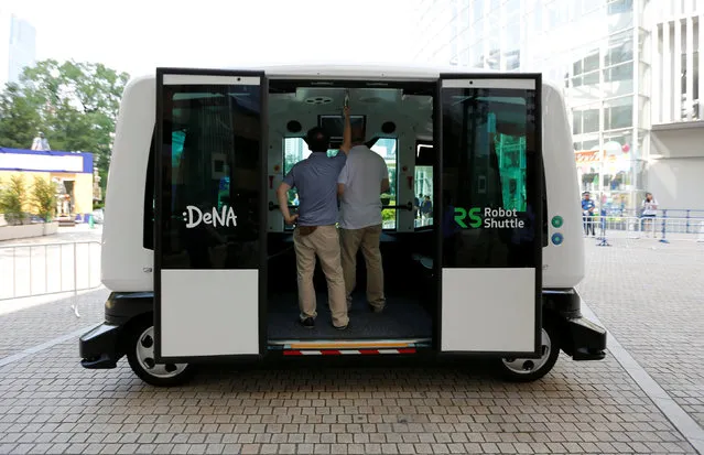Japan's internet commerce and mobile games provider DeNA Co's Robot Shuttle, a driver-less, self driving bus, is seen during its demonstration in Tokyo, Japan July 7, 2016. (Photo by Toru Hanai/Reuters)