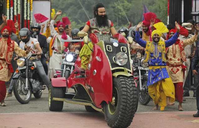 In this Wednesday, October 5, file 2016 photo, Indian spiritual guru, who calls himself Saint Dr. Gurmeet Ram Rahim Singh Ji Insan, arrives for a press conference ahead of the release of his new film “MSG, The Warrior Lion Heart”, in New Delhi, India. Several cities in north India were under a security lock down Thursday ahead of a verdict in a rape trial involving the controversial and hugely popular spiritual leader. (Photo by Tsering Topgyal/AP Photo)