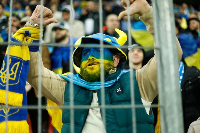 Ukraine fans cheer prior to the UEFA EURO 2024 Group C qualifying football match between Ukraine and Italy at the BayArena Stadium in Leverkusen, western Germany on November 20, 2023. (Photo by Leon Kuegeler/AFP Photo)