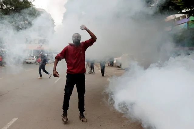 An activist reacts as tear gas is fired by police during anti-government protests dubbed “Saba Saba People's March”, in downtown Nairobi, Kenya on July 7, 2020. (Photo by Thomas Mukoya/Reuters)