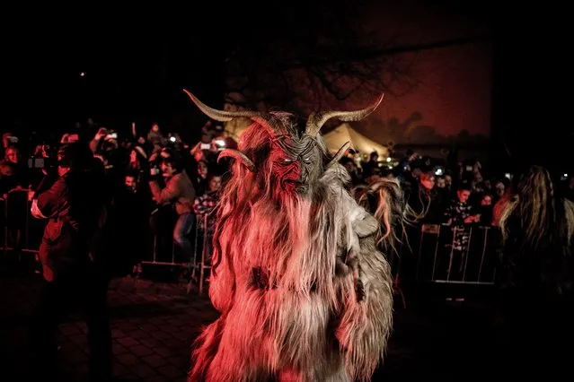 Participants dressed as Krampus walk at the street during Krampus gathering on November 26, 2016 in Zidlochovice (at Brno), Czech Republic. (Photo by Lukas Kabon/Anadolu Agency/Getty Images)