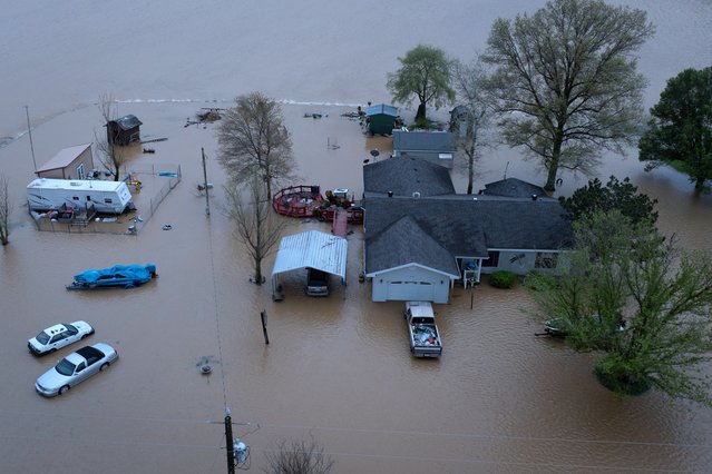An aerial view shows floodwaters surrounding a rural home on April 06, 2025 near Poplar Bluff, Missouri. Thunderstorms, heavy rains, high winds and tornadoes have plagued the regions for the past several days causing widespread damage. (Photo by Scott Olson/Getty Images)