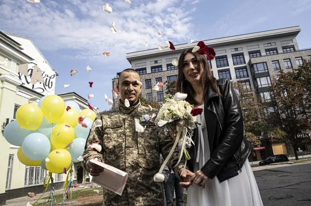 A newly married couple, Ukrainian soldier Kurilo Ihor, who has drive an ambulence, and Lushnikova Yila are seen in Kharkiv, Ukraine on September 15, 2022. (Photo by Metin Aktas/Anadolu Agency via Getty Images)