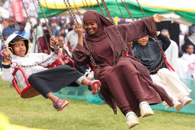 Muslims sit on a fun-fair merry go round after attending prayers to mark the Muslim holiday of Eid al-Adha at the Sir Ali Muslim Club Ground Nairobi, Kenya, on June 6, 2025. (Photo by Monicah Mwangi/Reuters)
