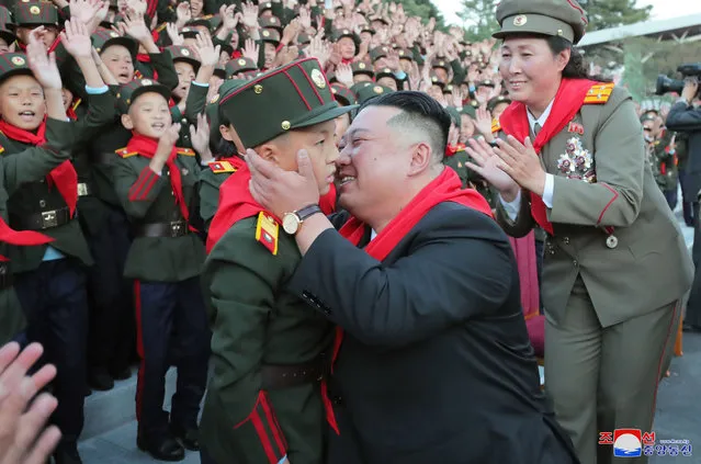 A photo released by the official North Korean Central News Agency (KCNA) shows North Korean leader Kim Jong-un (C-R) embracing a student while attending a ceremony to mark the 75th anniversary of the Mangyongdae Revolutionary School and Kang Pan Sok Revolutionary School in Pyongyang, North Korea, 12 October 2022. (Photo by KCNA/EPA/EFE/Rex Features/Shutterstock)