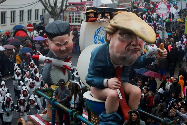 A carnival chariot is seen with figures of U.S. President Donald Trump and North Korean leader Kim Jong Un during a parade in Torres Vedras, Portugal February 11, 2018. (Photo by Pedro Nunes/Reuters)