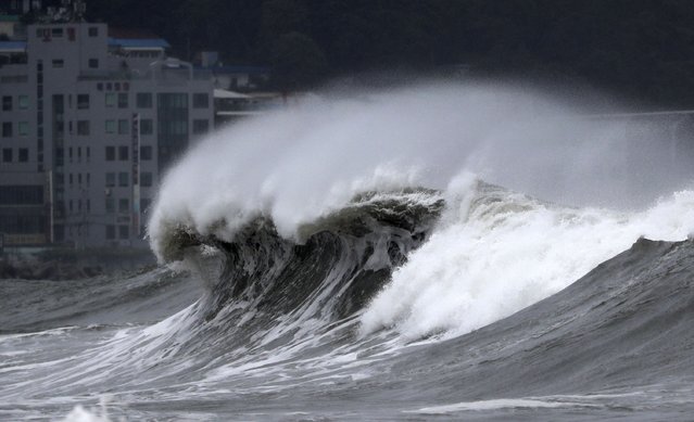 High waves crash onto a beach in Busan, South Korea, as Typhoon Hinnamnor approaches the Korean Peninsula on Monday, September 5, 2022. Hundreds of flights were grounded and more than 200 people evacuated in South Korea on Monday as Typhoon Hinnamnor approached the southern region with heavy rains and winds of up to 170 kilometers (105 miles) per hour, putting the nation on alert for its worst storm in decades. (Photo by Son Hyung-joo/Yonhap via AP Photo)