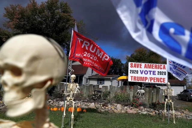 Halloween decorations and support for U.S. President Donald Trump are seen in the front of supporter Maranda Joseph's yard in Warren, Ohio, U.S., October 2, 2020. (Photo by Shannon Stapleton/Reuters)