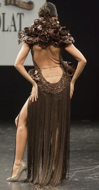 French TV Host Karine Lima presents a chocolate studded dress during a show as part of the chocolate fair in Paris, Tuesday, October 27, 2015. (Photo by Jacques Brinon/AP Photo)