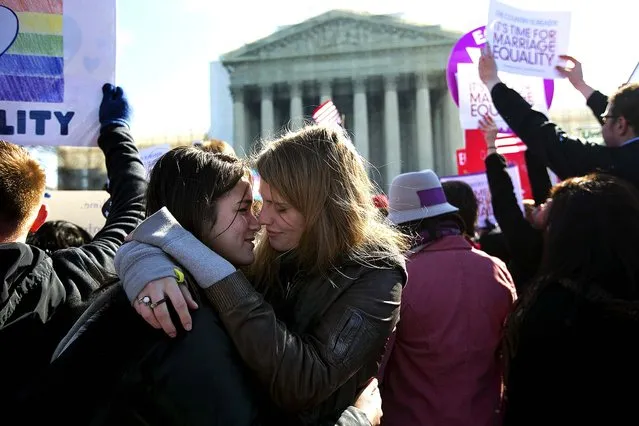 Alexandria Waldon and Hannah King share a moment outside the U.S. Supreme Court in Washington, on March 27, 2013, as the court returned to the subject of same-s*x marriage for a second day Wednesday, when the justices heardarguments about the constitutionality of the federal Defense of Marriage Act of 1996. (Photo by Doug Mills/The New York Times)