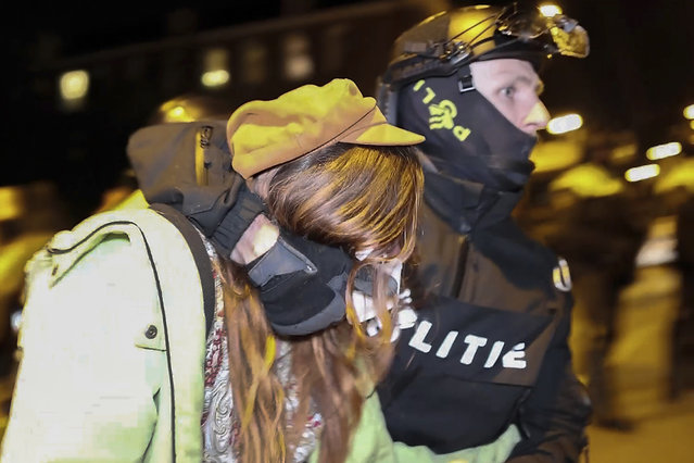 In this image taken from video Police arrests some 125 activists as they broke up a pro-Palestinian demonstration camp at the University of Amsterdam in Amsterdam, the Netherlands, Tuesday, May 7, 2024, as protests that have roiled campuses in the United States spread into Europe. (Photo by InterVision/AP Photo)