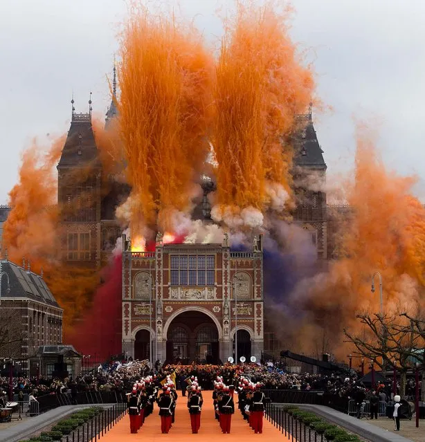 Fireworks explode during the official opening of the renovated Rijksmuseum in Amsterdam, Netherlands, on April 13, 2013. The Rijksmuseum, home of Rembrandt's “The Night Watch” and other national treasures, reopensed its doors to the public after a decade-long renovation. (Photo by Peter Dejong/Associated Press)