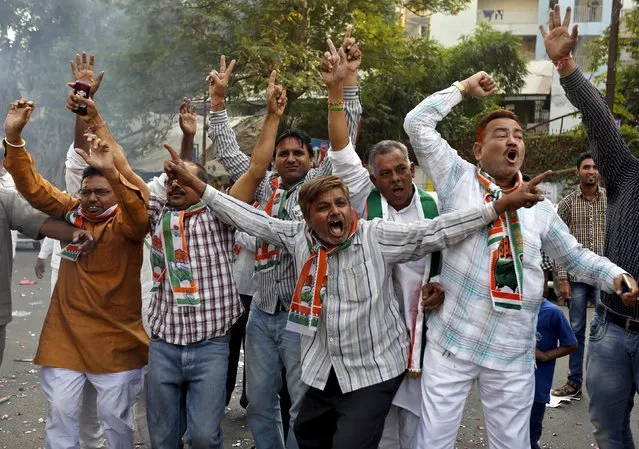 Supporters of Congress party celebrate after learning of initial results outside the party office in Ahmedabad, India, November 8, 2015. Prime Minister Narendra Modi suffered a heavy defeat on Sunday in an election in Bihar, India's third most-populous state, signalling the waning power of a leader who until recently had an unrivalled reputation as a vote winner. (Photo by Amit Dave/Reuters)