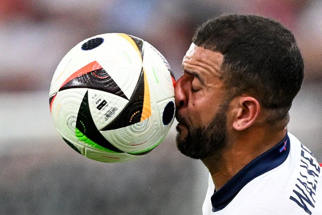 England's defender #02 Kyle Walker goes for a header during the UEFA Euro 2024 Group C football match between Denmark and England at the Frankfurt Arena in Frankfurt am Main on June 20, 2024. (Photo by Kirill Kudryavtsev/AFP Photo)