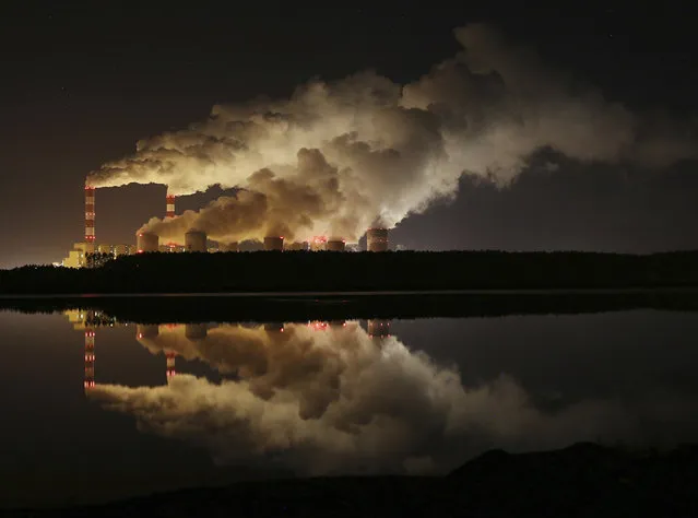 In this Wednesday, November 28, 2018 file photo clouds of smoke are pictured over Europe's largest lignite power plant in Belchatow, central Poland. Government stimulus programs to pull the world out of the coronavirus pandemic offer “a tremendous opportunity” to build a clean-energy economy, former California governor Arnold Schwarzenegger said Thursday, calling on governments not to “invest in the past”. Speaking video link from Los Angeles to the Austrian World Summit in Vienna, Schwarzenegger said that “forward-looking decisions” are needed now as trillions are being poured into rebuilding economies around the globe.A group of Greenpeace environment activists have climbed its 180-meter smokestack to spur participants in next week's global climate summit in Poland into taking decisions on limiting the use of coal.(Photo by Czarek Sokolowski/AP Photo/File)