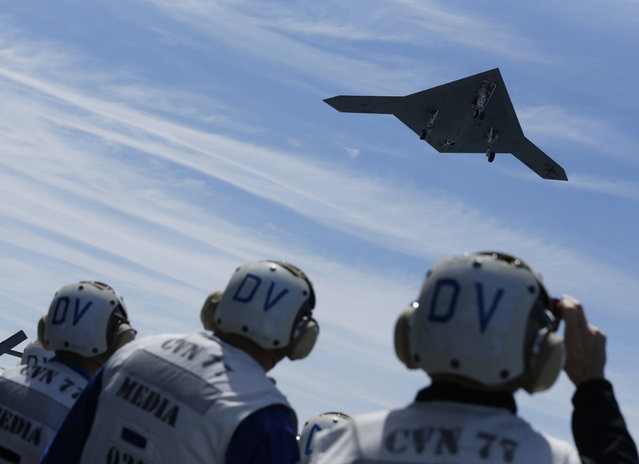 An X-47B pilot-less drone combat aircraft is launched for the first time off an aircraft carrier, the USS George H. W. Bush, in the Atlantic Ocean off the coast of Virginia, May 14, 2013. The U.S. Navy made aviation history on Tuesday by catapulting an unmanned jet off an aircraft carrier for the first time, testing a long-range, stealthy, bat-winged plane that represents a jump forward in drone technology. (Photo by Jason Reed/Reuters)
