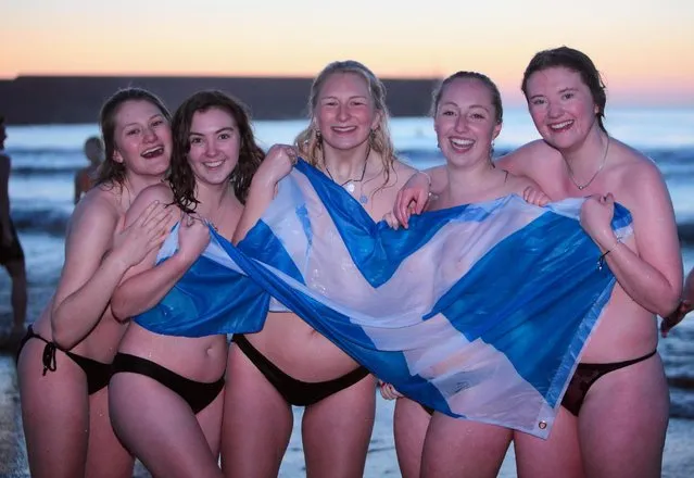Students from the University of St Andrews jump into The North Sea, as a good luck tradition before exams start on the East Sands in St Andrews, Fife, Scotland on May 1, 2018. (Photo by Derek Allan/Alamy Live News)