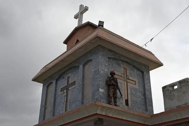 A member of the Frontier Constabulary (FC) stands guard at the Bethel Memorial Methodist Church in Quetta on April 9, 2023. (Photo by Banaras Khan/AFP Photo)