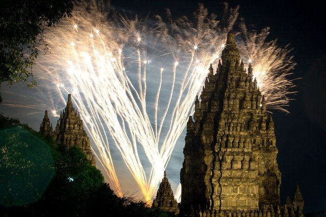 Fireworks light up above Prambanan Temple, a 9th-century Hindu temple complex and UNESCO World Heritage Site, in Yogyakarta on January 1, 2025. (Photo by Devi Rahman/AFP Photo)