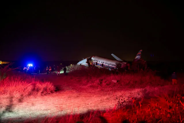 Emergency Services attend the scene of a plane crash outside South Africa's capital Pretoria, South Africa, July 10,2018. Nineteen people were injured when a plane crashed on July 10, in a grassy area of the South African capital Pretoria, emergency services said, giving a preliminary toll. “Medics from ER24 and other services are at the scene of a plane crash at Wonderboom in Pretoria”, Russell Meiring, spokesman for the ER24 medical service said. “We have 19 injured casualties ranging from minor to critical injuries at this stage and no confirmed fatalities”. (Photo by Yeshiel Panchia/Reuters)