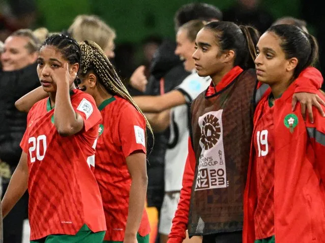 Morocco's midfielder #20 Sofia Bouftini (L) reacts with teammates after losing against Germany in their Australia and New Zealand 2023 Women's World Cup Group H football match at Melbourne Rectangular Stadium, also known as AAMI Park, in Melbourne on July 24, 2023. (Photo by William West/AFP Photo)