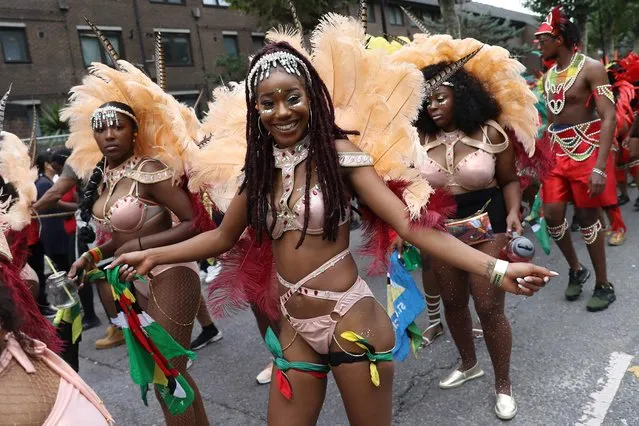Performers in costume take part in the carnival on the main Parade day of the Notting Hill Carnival in west London on August 27, 2018. (Photo by Daniel Leal-Olivas/AFP Photo)