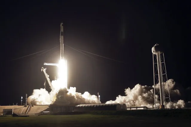 A SpaceX Falcon 9 rocket with the Crew Dragon space capsule lifts off from pad 39A at the Kennedy Space Center in Cape Canaveral, Fla., Friday, April 23, 2021. (Photo by John Raoux/AP Photo)