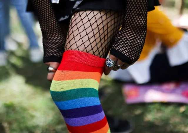 A participant pulls up her stocking during an event arranged for fundraising for the LGBTQ+ community in New Delhi, India on June 11, 2022. (Photo by Anushree Fadnavis/Reuters)