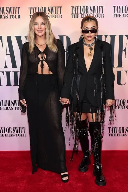 Songstress Hayley Kiyoko and “The Bachelor” star Becca Tilley held hands as they walked the red carpet for the premiere of gal pal Taylor Swift's concert film, “Taylor Swift: The Eras Tour” in  Los Angeles, California on October 11, 2023. (Photo by John Salangsang/Rex Features/Shutterstock)