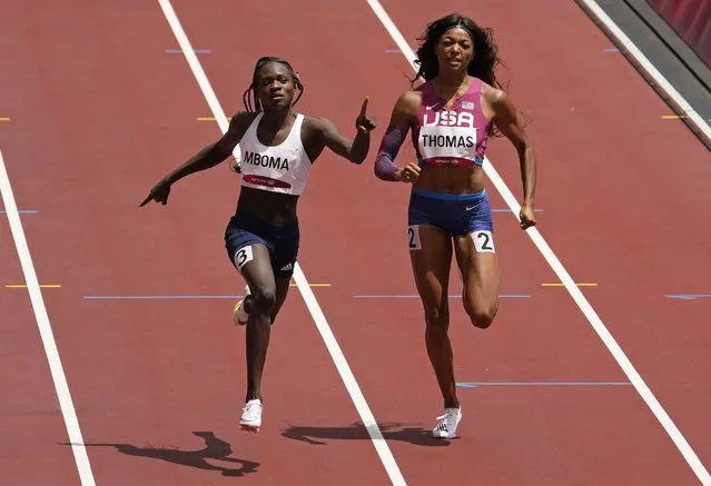 Christine Mboma, of Namibia, left, leads Gabrielle Thomas, of United States in a women's 200-meter first round heat at the 2020 Summer Olympics, Monday, August 2, 2021, in Tokyo, Japan. (Photo by Charlie Riedel/AP Photo)
