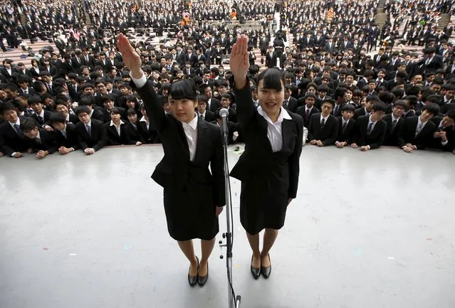 Japanese college students publicly declare that they will do their best in trying to find work during a job-hunting pep rally held to boost their morale, at an outdoor theatre in Tokyo February 25, 2016. (Photo by Issei Kato/Reuters)