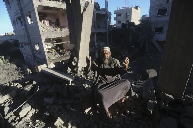 A Palestinian reacts after an Israeli strike on residential buildings in Rafah, Gaza Strip, on Friday, December 15, 2023. (Photo by Hatem Ali/AP Photo)