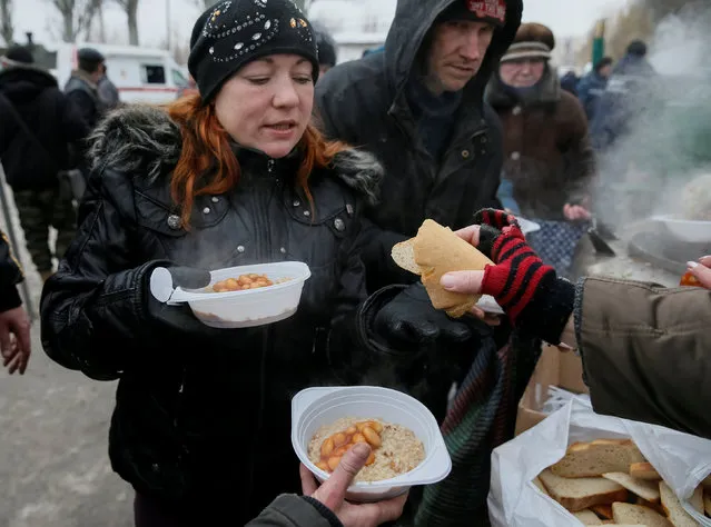 Local residents have a meal at an emergency center after shelling hit supply infrastructure in the government-held industrial town of Avdiyivka, Ukraine, February 3, 2017. (Photo by Gleb Garanich/Reuters)