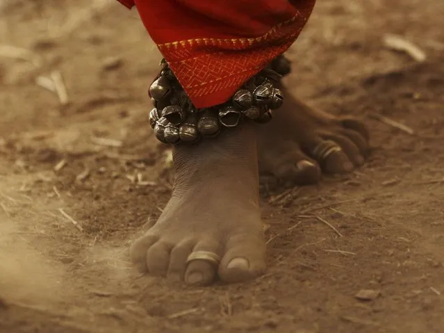 A member of Dongria tribe wearing traditional ornaments dances during the two-day long Niyamraja Festival atop of the Niyamgiri hills near Lanjigarh in Kalahandi district, Orissa state. (Photo by Biswaranjan Rout/AP Photo)