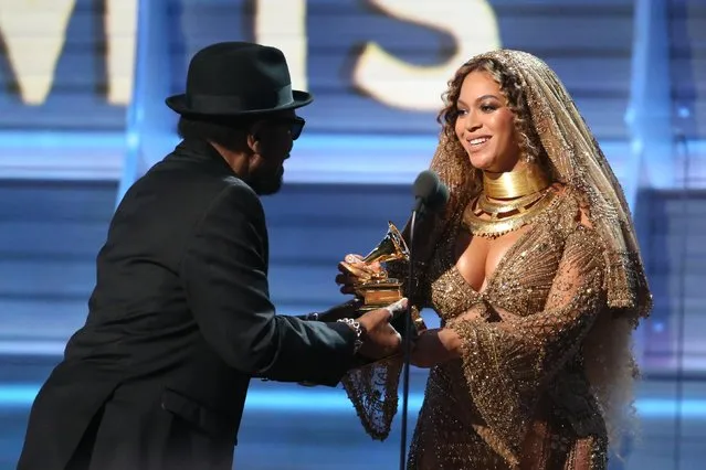 Beyonce accepts the Grammy for Best Urban Contemporary Album for “Lemonade” from presenter William Bell at the 59th Annual Grammy Awards in Los Angeles, California, U.S. , February 12, 2017. (Photo by Lucy Nicholson/Reuters)