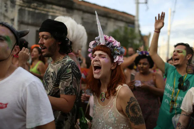 Revellers takes part in the annual block party Cordao de Prata Preta during carnival festivities in Rio Janeiro, Brazil February 25, 2017. (Photo by Pilar Olivares/Reuters)