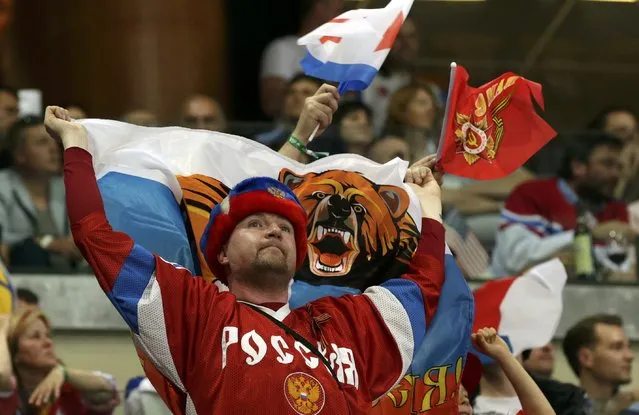 A fan of Russia waves flag during their Ice Hockey World Championship semifinal game against the U.S. at the O2 arena in Prague, Czech Republic May 16, 2015. (Photo by David W. Cerny/Reuters)