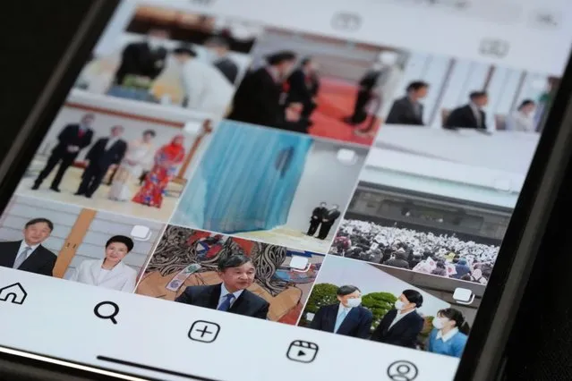 The part of the instagram page of Japan's Imperial Household Agency is seen on a mobile phone Monday, April 1, 2024, in Tokyo. Japan’s Imperial Family made an Instagram debut on Monday, with images of Emperor Naruhito and Empress Masako capturing moments of their official duties, an effort to shake off their cloistered image and reach out to the younger generations. (Photo by Eugene Hoshiko/AP Photo)