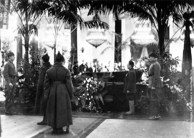 1924: Soldiers stand to attention by Lenin's coffin at his lying-in-state in the Labour temple, Moscow, formerly the Colonial Hall of the Nobles