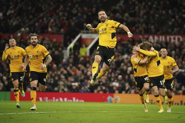 Wolverhampton Wanderers' Joao Moutinho celebrates after scoring his side's first goal during the English Premier League soccer match between Manchester United and Wolverhampton Wanderers at Old Trafford stadium in Manchester, England, Monday, January 3, 2022. (Photo by Dave Thompson/AP Photo)