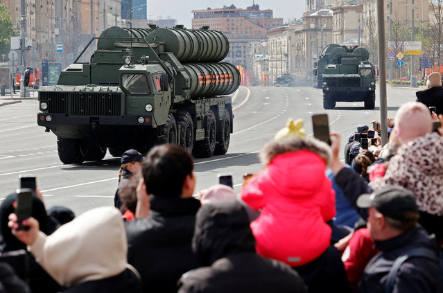 Spectators watch Russia's S-400 air defence system units after the Victory Day military parade in Moscow, Russia on May 9, 2024. (Photo by Yulia Morozova/Reuters)