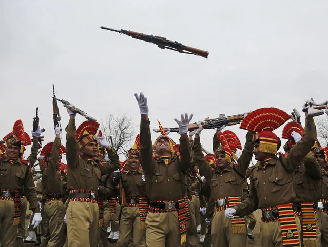 New recruits of the Indian Border Security Force (BSF) raise their weapons in air as they celebrate their graduation ceremony in Humhama, outskirts of Srinagar, Indian controlled Kashmir, Wednesday, March 8, 2017. A total of 126 recruits formally inducted into the BSF, will join Indian soldiers fighting separatist Islamic guerrillas in Kashmir to help end an insurgency that started in 1989. (Photo by Mukhtar Khan/AP Photo)