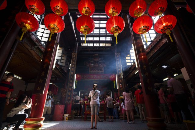 Malaysian ethnic Chinese pray on the first day of Lunar New Year's holidays at a temple in Kuala Lumpur, Malaysia Saturday, February 10, 2024. (Photo by Vincent Thian/AP Photo)