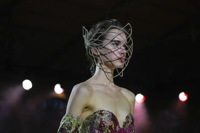 A model wears a creation for the Elie Saab Spring-Summer 2022 Haute Couture fashion collection, in Paris, Wednesday, January 26, 2022. (Photo by Francois Mori/AP Photo)