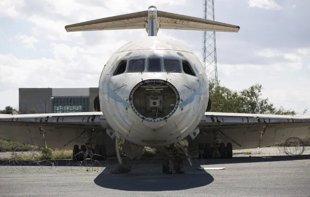 A Cyprus Airways passenger jet stands in the abandoned Nicosia International Airport near Nicosia March 10, 2014. (Photo by Neil Hall/Reuters)