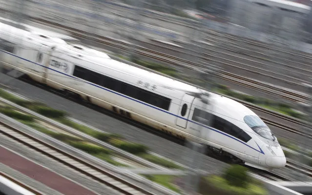 A CRH380BL high-speed bullet train runs towards Beijing South Railway Station Friday, August 12, 2011. (Photo by Jason Lee/Reuters)