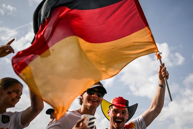 A Germany supporter waves the German flag at the fanzone of the Westfalenpark in Dortmund, western Germany on June 29, 2024 before the UEFA Euro 2024 round of 16 football match between Germany and Denmark. (Photo by Patrícia de Melo Moreira/AFP Photo)